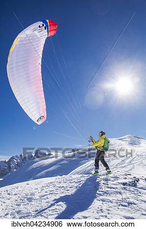 Paraglider, man preparing glider for takeoff, Axamer Lizum, Innsbruck, Tyrol, Austria, Europe View Large Photo Image Stock Photograph - Paraglider, man preparing glider for takeoff, Axamer Lizum, Innsbruck, Tyrol, Austria, Europe. Fotosearch