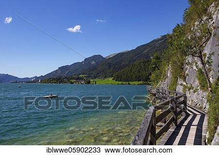 Pavement with view to Sankt Wolfgang, Strobl am Wolfgangsee, Salzkammergut, Province of Salzburg, Austria, Europe View Large Photo Image Stock Image - Pavement with view to Sankt Wolfgang, Strobl am Wolfgangsee, Salzkammergut, Province of Salzburg, Austria, Europe. Fotosearch