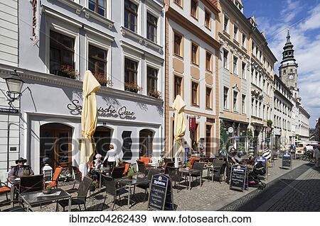 Stock Photo - Pedestrian street with cafes and view of old town hall tower, Bruderstrasse, Gorlitz, Oberlausitz, Saxony, Germany, Europe. Fotosearch