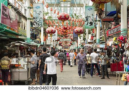 People walk on Petaling Street in Chinatown, Kuala Lumpur, Malaysia, Asia View Large Photo Image Stock Photograph - People walk on Petaling Street in Chinatown, Kuala Lumpur, Malaysia, Asia. Fotosearch