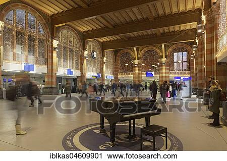 Piano for general use in the station concourse, Christmas decoration, Amsterdam Centraal railway station, Amsterdam, Holland, Netherlands View Large Photo Image Stock Image - Piano for general use in the station concourse, Christmas decoration, Amsterdam Centraal railway station, Amsterdam, Holland, Netherlands. Fotosearch