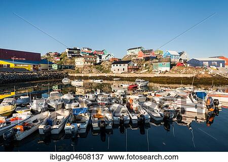 Stock Photo - Port with motorboats, blue sky, Maniitsoq, West Greenland, Greenland, North America. Fotosearch