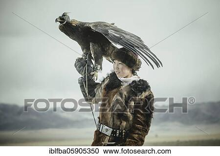Portrait of a young eagle hunter, Festival of eagle hunters in the province of Olgii, about 20 km from the provincial capital, Olgii, Mongolia, Asia View Large Photo Image Stock Image - Portrait of a young eagle hunter, Festival of eagle hunters in the province of Olgii, about 20 km from the provincial capital, Olgii, Mongolia, Asia. Fotosearch