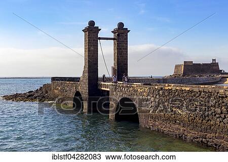 Puente de las Bolas, drawbridge in front of the fort, Castillo de San Gabriel, Arrecife, Lanzarote, Canary Islands, Spain, Europe View Large Photo Image Stock Image - Puente de las Bolas, drawbridge in front of the fort, Castillo de San Gabriel, Arrecife, Lanzarote, Canary Islands, Spain, Europe. Fotosearch