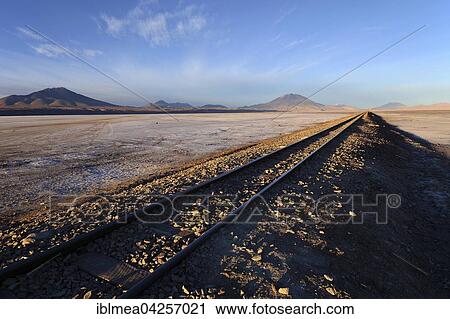 Railway track in the morning light, near Cementerio de los trenes, Uyuni, Bolivia, South America View Large Photo Image Stock Image - Railway track in the morning light, near Cementerio de los trenes, Uyuni, Bolivia, South America. Fotosearch