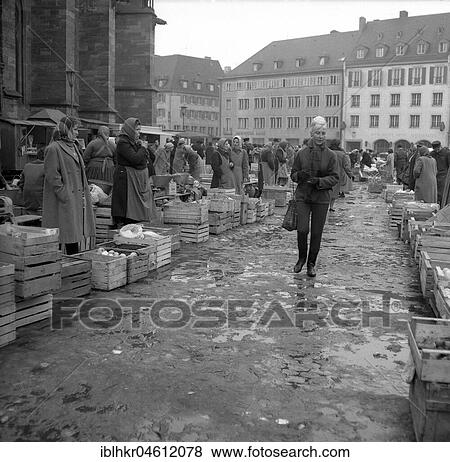 Rain puddles on the market place, Freiburger Münstermarkt, approx. 1945 to 1955, Freiburg, Germany, Europe View Large Photo Image Stock Photo - Rain puddles on the market place, Freiburger Münstermarkt, approx. 1945 to 1955, Freiburg, Germany, Europe. Fotosearch