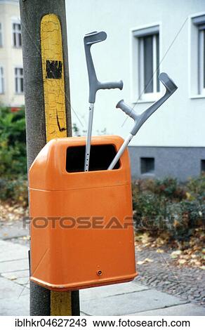 Stock Image - Recovery, crutches in garbage cans, Berlin, Germany, Europe. Fotosearch