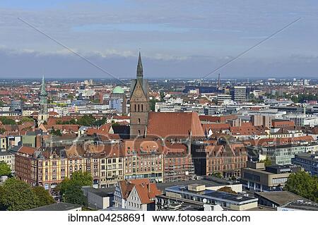 Stock Image - Red brick houses with the market church and the historic centre, Hanover-Mitte, Hanover, Lower Saxony, Germany, Europe. Fotosearch