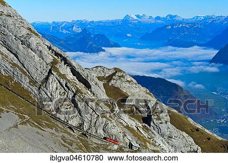 Red wagon of the Pilatus Railway at Mount Pilatus, mountain panorama in the background, Alpnachstad, Switzerland, Europe View Large Photo Image Stock Image - Red wagon of the Pilatus Railway at Mount Pilatus, mountain panorama in the background, Alpnachstad, Switzerland, Europe. Fotosearch