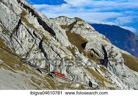 Red wagon of the Pilatus Railway at Mount Pilatus, Alpnachstad, Switzerland, Europe View Large Photo Image Stock Image - Red wagon of the Pilatus Railway at Mount Pilatus, Alpnachstad, Switzerland, Europe. Fotosearch