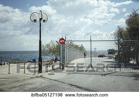 Refugees on a cordoned-off site in Mytilene, Lesbos, Greece, Europe View Large Photo Image Stock Photo - Refugees on a cordoned-off site in Mytilene, Lesbos, Greece, Europe. Fotosearch