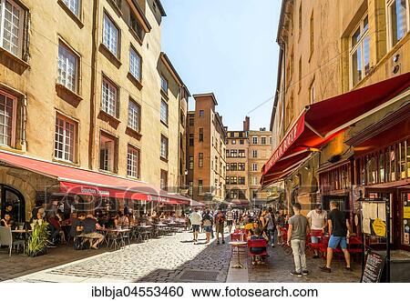 Stock Image - Restaurants at Place Neuve Saint-Jean on Old Town in Lyon city, Lyon, Auvergne Rhone Alpes, France, Europe. Fotosearch