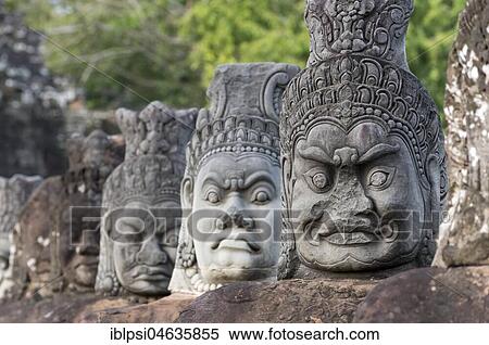 Row of demon statues along the balustrade outside the South Gate of Angkor Thom, Cambodia, Asia View Large Photo Image Stock Photography - Row of demon statues along the balustrade outside the South Gate of Angkor Thom, Cambodia, Asia. Fotosearch