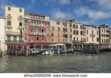 Row of houses and gondola station, by Rialto Bridge, Grand Canal, district San Polo, San Marco, Venice, Veneto, Italy, Europe View Large Photo Image Stock Photo - Row of houses and gondola station, by Rialto Bridge, Grand Canal, district San Polo, San Marco, Venice, Veneto, Italy, Europe. Fotosearch