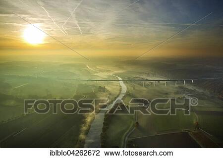 Stock Image - Ruhr viaduct over Ruhr, Bundesautobahn A52, Sunrise with fog in autumn, Mulheim, Mintard, Ruhr district, North Rhine-Westphalia, Germany, Europe. Fotosearch