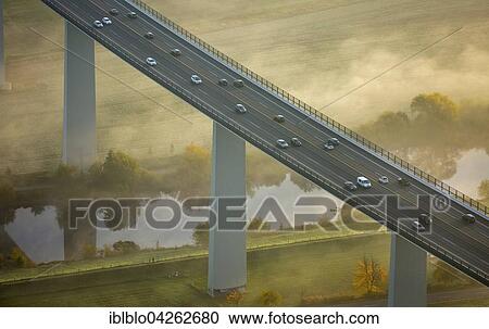 Stock Image - Ruhr viaduct over Ruhr, Bundesautobahn A52 with traffic, fog in autumn, Mulheim, Mintard, Ruhr district, North Rhine-Westphalia, Germany, Europe. Fotosearch