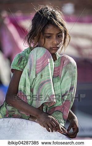 Sad girl sitting on a wall, portrait, Pushkar, Rajasthan, India, Asia View Large Photo Image Stock Photography - Sad girl sitting on a wall, portrait, Pushkar, Rajasthan, India, Asia. Fotosearch