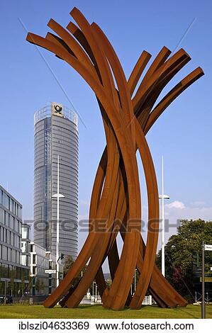 Sculpture Arc 89 in front of the Post Tower, artist Bernar Venet, Helmut-Schmidt-Platz, Bonn, North Rhine-Westphalia, Germany, Europe View Large Photo Image Stock Photo - Sculpture Arc 89 in front of the Post Tower, artist Bernar Venet, Helmut-Schmidt-Platz, Bonn, North Rhine-Westphalia, Germany, Europe. Fotosearch