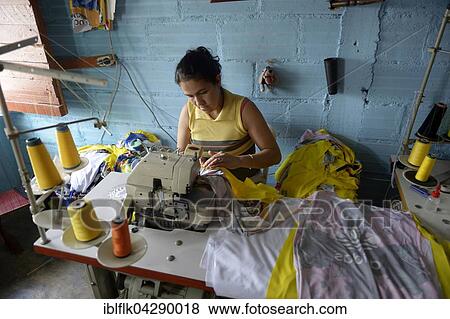 Stock Photo - Seamstress in Comuna 8 slum, Medellin, Antioquia Department, Colombia, South America. Fotosearch