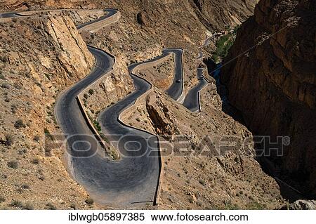 Serpentine road R704 near Timzzillite in the upper Dade Valley, High Atlas, South Morocco, Morocco, Africa View Large Photo Image Stock Photography - Serpentine road R704 near Timzzillite in the upper Dade Valley, High Atlas, South Morocco, Morocco, Africa. Fotosearch