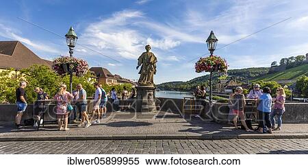 Stock Photography - Serving Franconian wine at bar tables, Brückenschoppen, Alte Mainbrücke, Würzburg, Franconia, Bavaria, Germany, Europe. Fotosearch