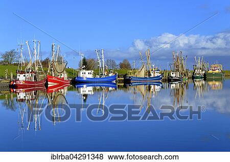 Stock Photo - Shrimp boats in harbour, Greetsiel, Lower Saxony, Germany, Europe. Fotosearch
