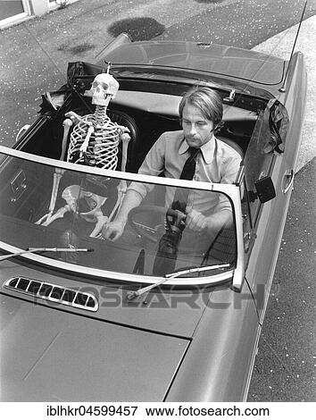 Skeleton and man driving car, England, Great Britain View Large Photo Image Stock Photo - Skeleton and man driving car, England, Great Britain. Fotosearch