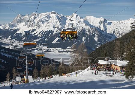 Ski lift at the Hauser Kaibling ski mountain, Dachstein massif and Enns valley in the fog, region Schladming Dachstein, Ski amade', Schladming, Styria, Austria, Europe View Large Photo Image Stock Photo - Ski lift at the Hauser Kaibling ski mountain, Dachstein massif and Enns valley in the fog, region Schladming Dachstein, Ski amade', Schladming, Styria, Austria, Europe. Fotosearch