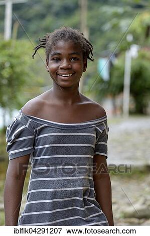 Smiling girl, portrait, afro-columbian village of El Salto on the River Rio Andagueda, Choco Department, Colombia, South America View Large Photo Image Stock Photo - Smiling girl, portrait, afro-columbian village of El Salto on the River Rio Andagueda, Choco Department, Colombia, South America. Fotosearch