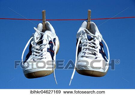 Stock Photo - Sneakers clothesline, Berlin, Germany, Europe. Fotosearch