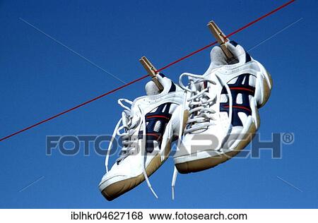 Stock Photo - Sneakers on a clothesline, Berlin, Germany, Europe. Fotosearch