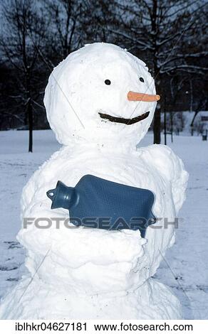 Stock Image - Snowman with hot water bottle, Berlin, Germany, Europe. Fotosearch