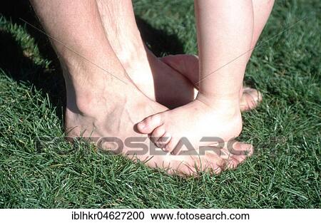 Standing on father's feet, Berlin, Germany, Europe View Large Photo Image Stock Image - Standing on father's feet, Berlin, Germany, Europe. Fotosearch
