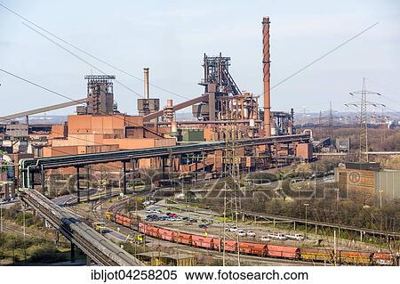 Stock Photography - Steelworks with blast furnaces Schwelgern 1 and 2, ThyssenKrupp Steel Europe, Hamborn, Duisburg, North Rhine-Westphalia, Germany, Europe. Fotosearch