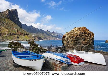 Steep coast in the Anaga mountains with beach section Playa de Roque de las Bodegas near the village of Taganana, fishing boats, Almáciga, Tenerife, Canary Island, Spain, Europe View Large Photo Image Stock Photography - Steep coast in the Anaga mountains with beach section Playa de Roque de las Bodegas near the village of Taganana, fishing boats, Almáciga, Tenerife, Canary Island, Spain, Europe. Fotosearch