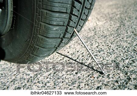 Stop, Nagel sticks in tire, Berlin, Germany, Europe View Large Photo Image Stock Image - Stop, Nagel sticks in tire, Berlin, Germany, Europe. Fotosearch