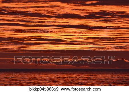 Sunrise over the sea, Baltic Sea coast near Sassnitz, Rügen, Mecklenburg-Western Pomerania, Germany, Europe View Large Photo Image Stock Photo - Sunrise over the sea, Baltic Sea coast near Sassnitz, Rügen, Mecklenburg-Western Pomerania, Germany, Europe. Fotosearch