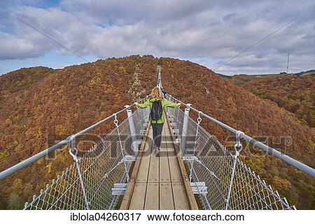 Suspension bridge over Geierlay Morsdorfer Bachtal, Morsdorf, Hunsruck, Rhineland-Palatinate, Germany, Europe View Large Photo Image Stock Photo - Suspension bridge over Geierlay Morsdorfer Bachtal, Morsdorf, Hunsruck, Rhineland-Palatinate, Germany, Europe. Fotosearch