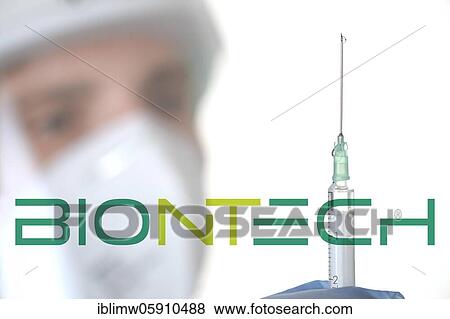 Stock Photo - Symbol image Corona vaccine from BIONTECH, man with syringe, corona crisis, Baden-Württemberg, Germany, Europe. Fotosearch