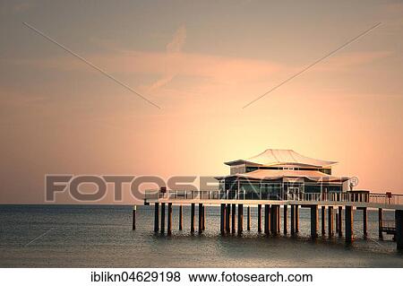 Tea House on the pier at dawn, Timmendorfer Strand, Baltic Sea, Schleswig-Holstein, Germany, Europe View Large Photo Image Stock Photo - Tea House on the pier at dawn, Timmendorfer Strand, Baltic Sea, Schleswig-Holstein, Germany, Europe. Fotosearch
