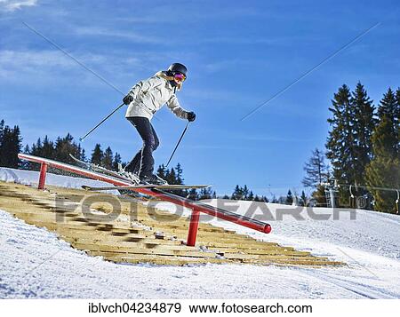 Stock Photo - Teenage skier with twin-tips, sliding on a rail, Muttereralmpark, Mutters, Tyrol, Austria, Europe. Fotosearch