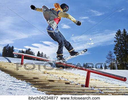 Stock Photo - Teenage snowboarder grinding a pole in a funpark, Muttereralmpark, Mutters, Tyrol, Austria, Europe. Fotosearch