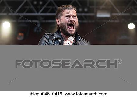 Stock Photo - The American rock band Rival Sons live at the 27th Heitere Open Air in Zofingen, Aargau, Switzerland Jay Buchanan, vocals Scott Holiday, guitar Dave Beste, bass. Fotosearch