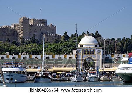 The New Market at Mandraki harbor, Grand Master's Palace behind, Rhodes Town, Rhodes, Dodecanese, Greece, Europe View Large Photo Image Picture - The New Market at Mandraki harbor, Grand Master's Palace behind, Rhodes Town, Rhodes, Dodecanese, Greece, Europe. Fotosearch
