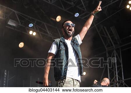 Picture - The swiss rapper and musician Marco Bliggensdorfer alias Bligg live at the 26th Heitere Open Air in Zofingen, Aargau, Switzerland, Europe. Fotosearch