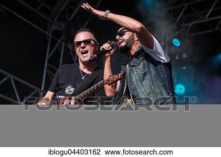 The swiss rapper and musician Marco Bliggensdorfer alias Bligg live at the 26th Heitere Open Air in Zofingen, Aargau, Switzerland, Europe View Large Photo Image Stock Image - The swiss rapper and musician Marco Bliggensdorfer alias Bligg live at the 26th Heitere Open Air in Zofingen, Aargau, Switzerland, Europe. Fotosearch