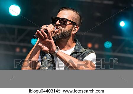 The swiss rapper and musician Marco Bliggensdorfer alias Bligg live at the 26th Heitere Open Air in Zofingen, Aargau, Switzerland, Europe View Large Photo Image Stock Photography - The swiss rapper and musician Marco Bliggensdorfer alias Bligg live at the 26th Heitere Open Air in Zofingen, Aargau, Switzerland, Europe. Fotosearch