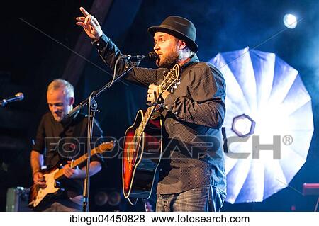 The Swiss singer and songwriter Lukas Linder alias Henrik Belden with band at the record baptism live in the Schüür Lucerne, Switzerland, Europe View Large Photo Image Stock Photo - The Swiss singer and songwriter Lukas Linder alias Henrik Belden with band at the record baptism live in the Schüür Lucerne, Switzerland, Europe. Fotosearch