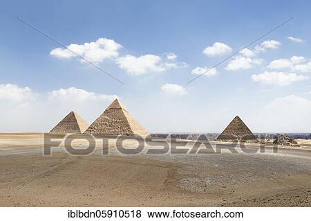 Stock Photo - The three main pyramids with Cairo in the background, Giza, Egypt, Africa. Fotosearch