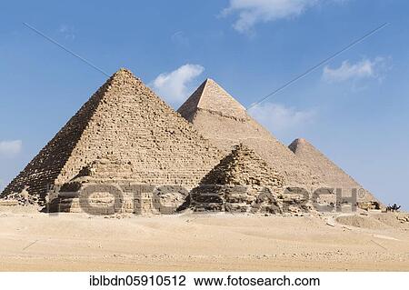 Stock Image - The three main pyramids with two of the three queen's pyramids in the foreground, Giza, Egypt, Africa. Fotosearch